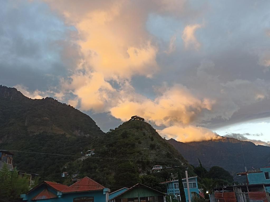 a view of a mountain under a cloudy sky at Casa Julian in San Juan La Laguna