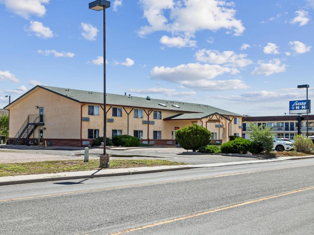 a building on the side of a road at Luxury Inn in Cheyenne