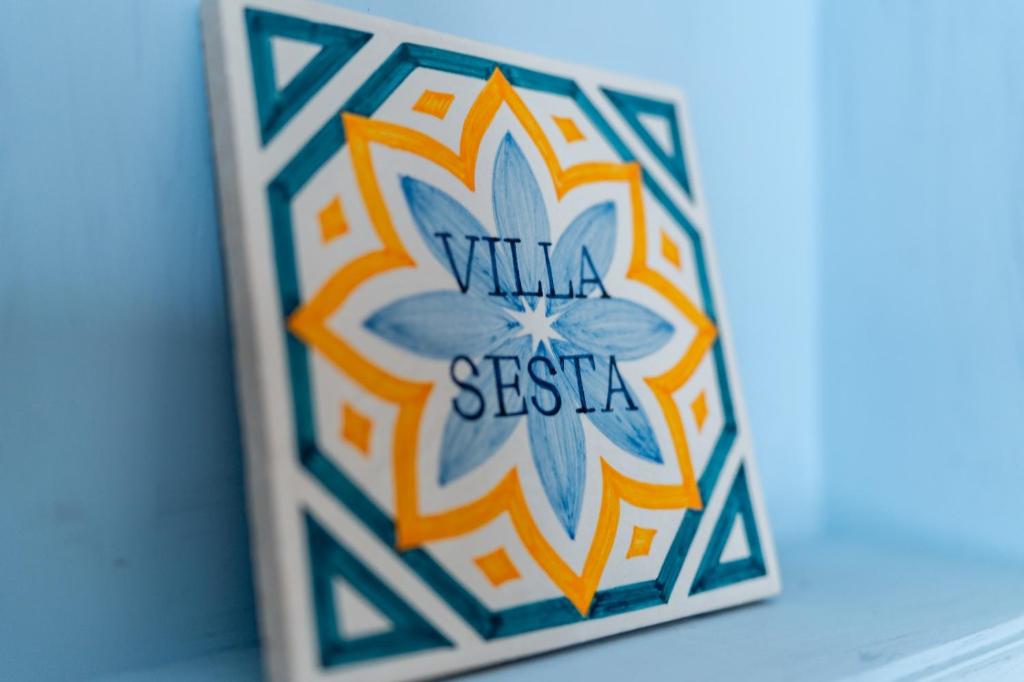 a picture of a tile with the word villa siesta on it at Villa Sesta in Vila de Frades