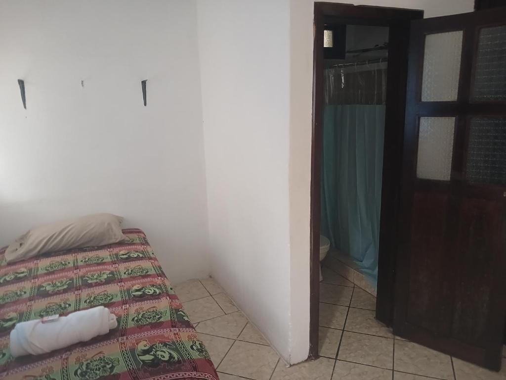 Postel nebo postele na pokoji v ubytování Posada colonial