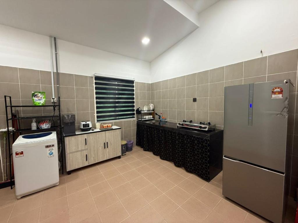 Kuchyň nebo kuchyňský kout v ubytování Villa Ammara Homestay