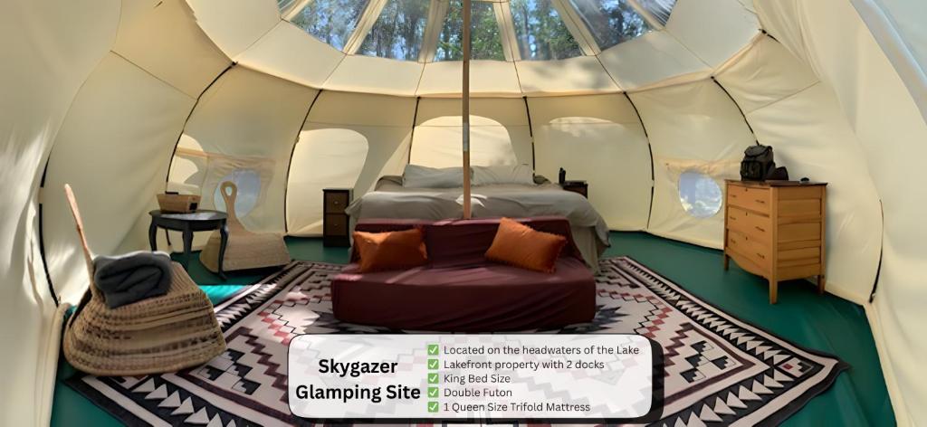 a bedroom in a tent with a bed in it at Smith Lake Farm in Merville