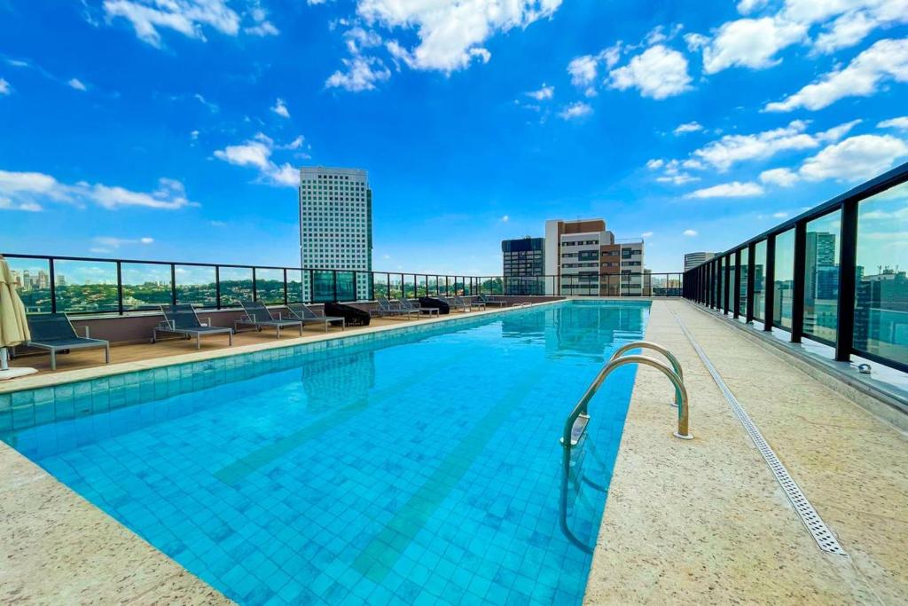 a swimming pool on the roof of a building at BSide Faria Lima Pinheiros in Sao Paulo