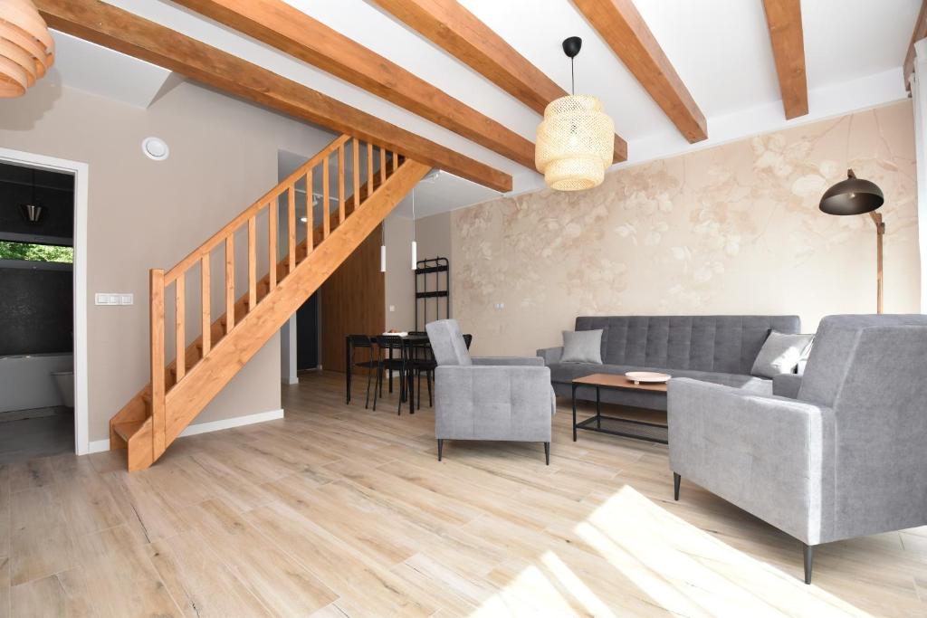 a living room with a couch and a table and chairs at Turawa 4 You in Turawa