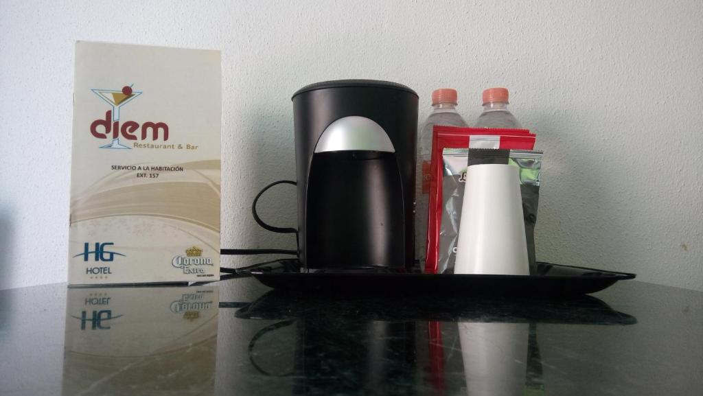 Příslušenství pro přípravu čaje a kávy v ubytování HG Hotel