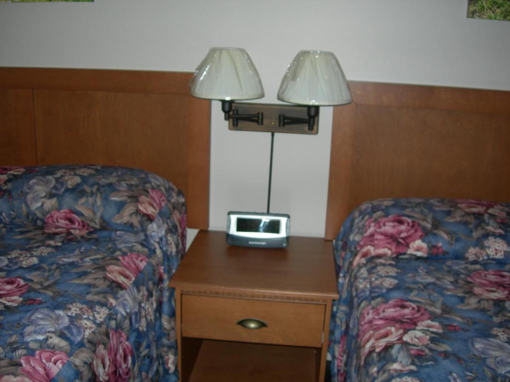 Postel nebo postele na pokoji v ubytování Hotel Motel Arnold