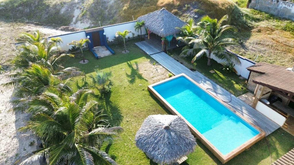 an aerial view of a villa with a swimming pool at POUSADA Coisa Mais Linda e Massagem in Cascavel