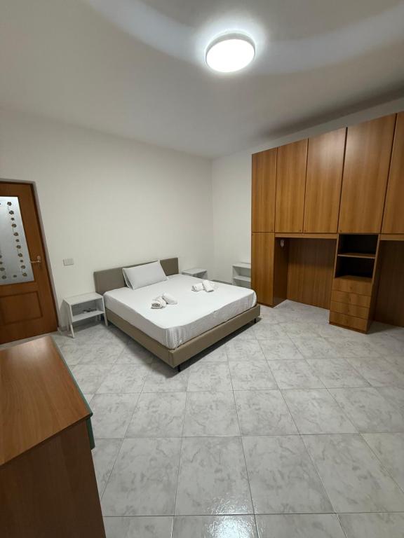 a bedroom with a bed in a room at Palazzo SantAntonio Apartament in Naples