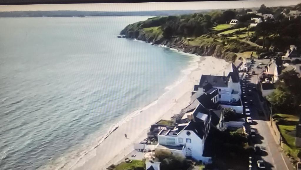 an aerial view of a beach with houses at ROOF TOP 50m2 VUE MER !! à 2 mn à pied de la PLAGE et de la THALASSOTHERAPIE ! in Concarneau