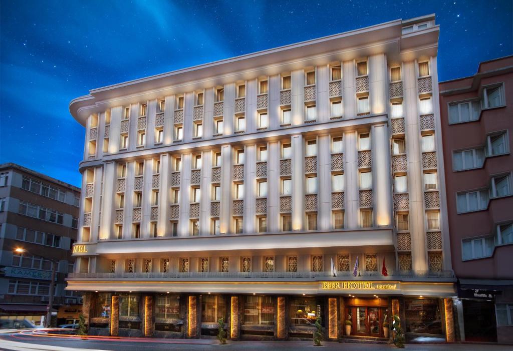 a large white building with columns at Berr Hotel in Istanbul