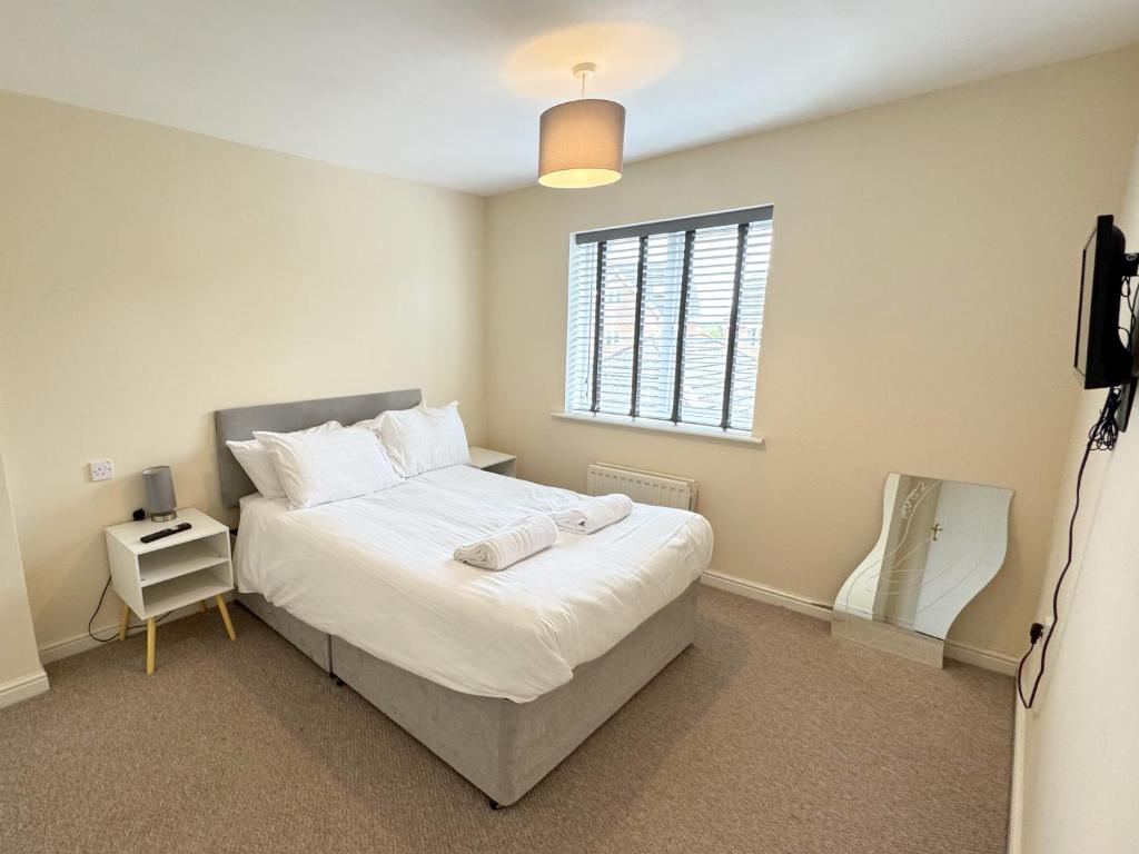 Ένα ή περισσότερα κρεβάτια σε δωμάτιο στο 5 Holborn Spacious Home
