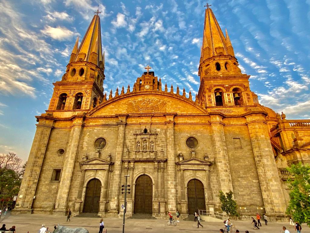an old church with two towers on top of it at Stylish Art Déco Mexican House with rooftop in Guadalajara