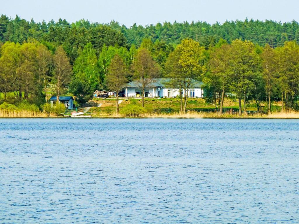 a house on the shore of a lake at Apartment Głęboczek 21 by Interhome in Głęboczek