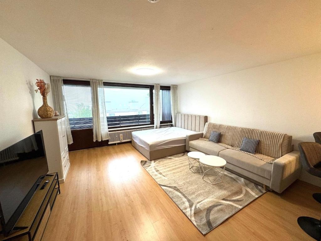 a living room with a couch and a table at NaturTraum Kniebis in Freudenstadt