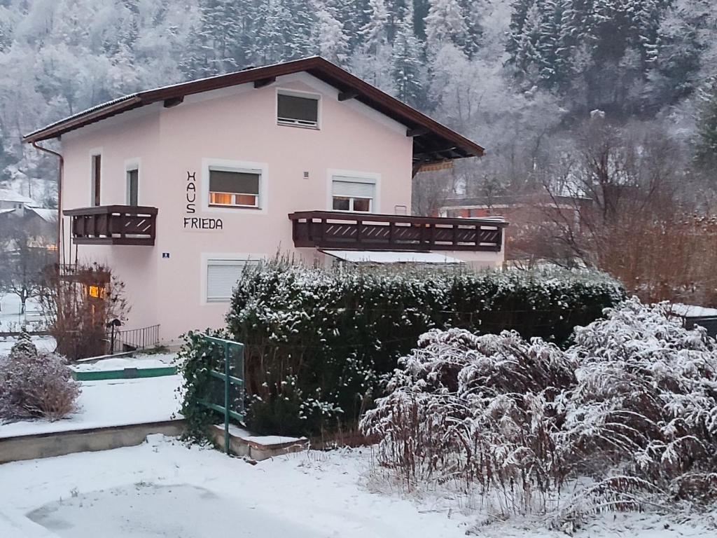 a house with snow on the ground in front of it at Apartment Frieda by Interhome in Zams