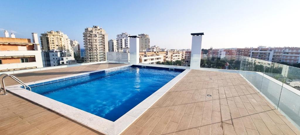 a swimming pool on the roof of a building at Algarve Dream Escape in Armação de Pêra