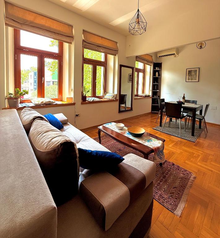 a living room with a couch and a table at Bokeska apartment in Podgorica