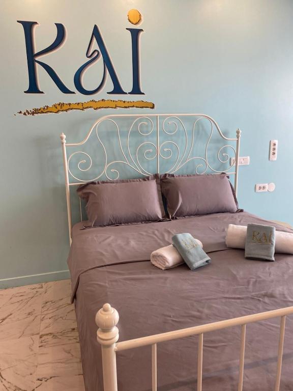a bedroom with a bed with the word ra on the wall at KAI Condo 3 Min Walking to Beach in Donja Lastva