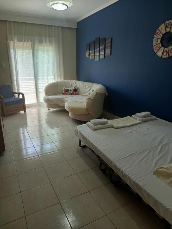 Ένα ή περισσότερα κρεβάτια σε δωμάτιο στο Olga's Studios Apartment3