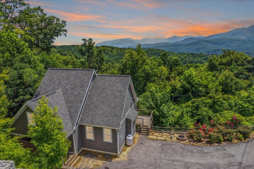 an aerial view of a house with mountains in the background at Amazing Views, Hot Tub, Arcade & Firepit in Gatlinburg