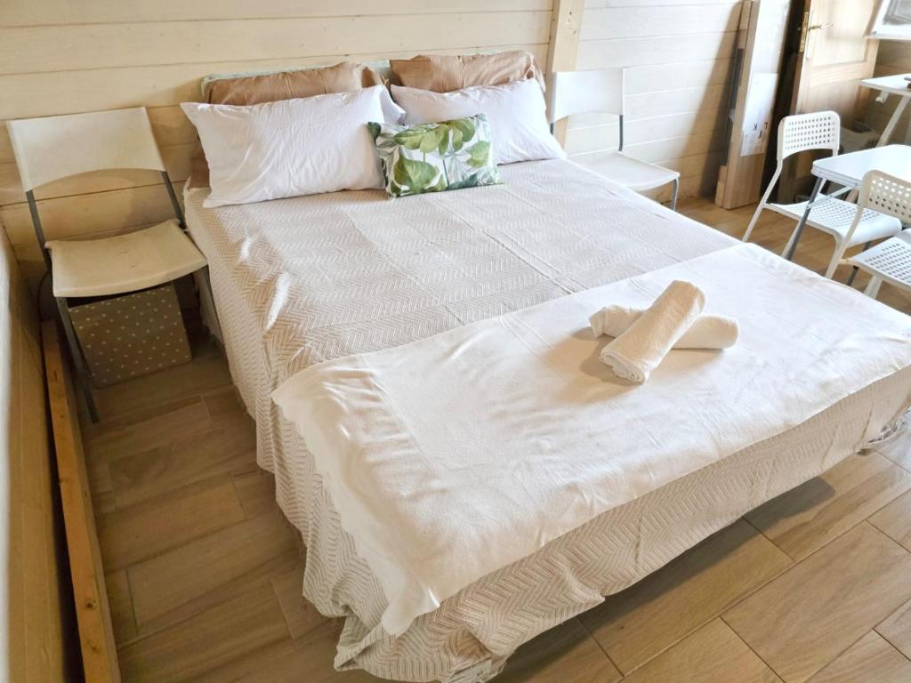 En eller flere senge i et værelse på Cabin-holiday