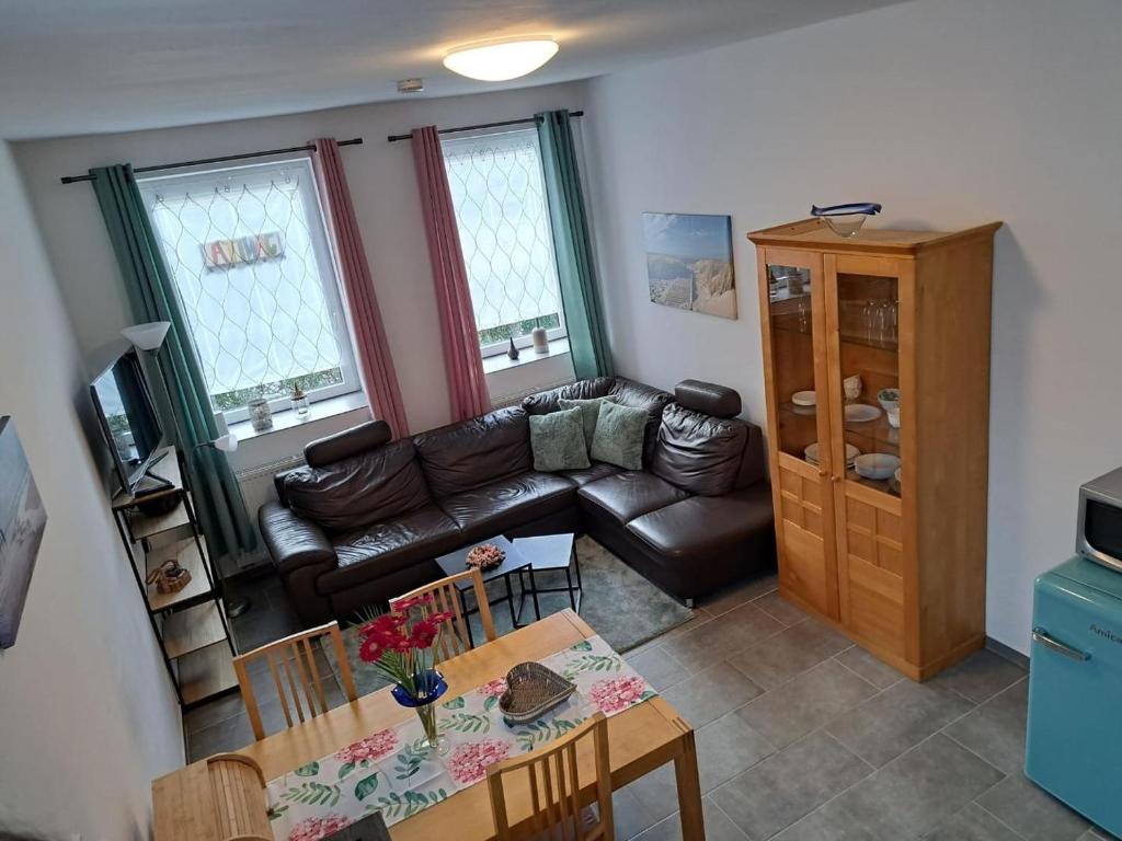 a living room with a couch and a table at Janita in Meeschendorf