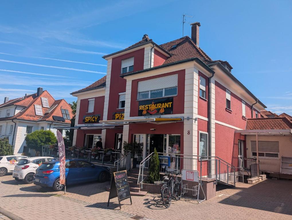 a building with a restaurant on a street at Backstubencafe Beck in Ansbach