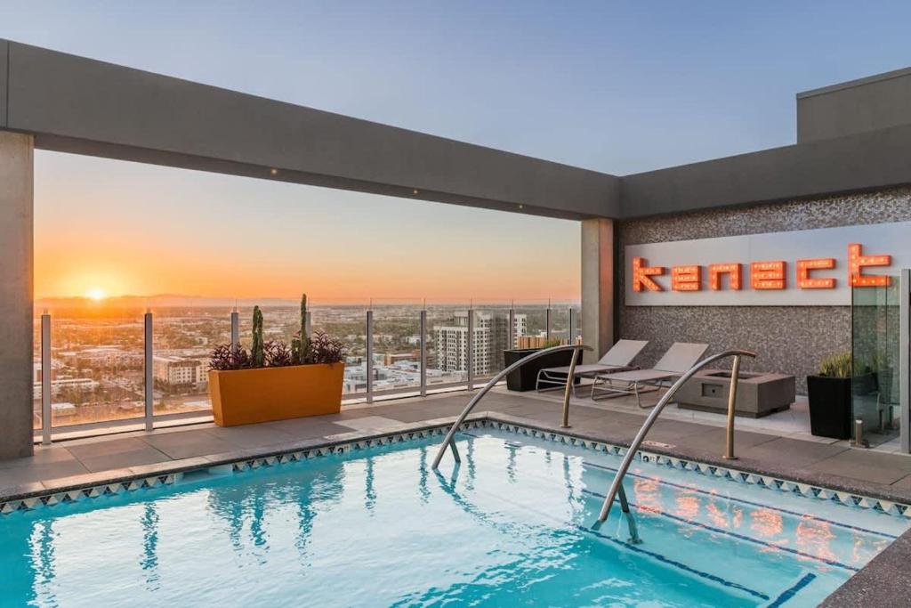 a swimming pool on the roof of a hotel at Boulevard Stays Downtown Highrise STU Sky Pool Parking Gym 01 in Phoenix