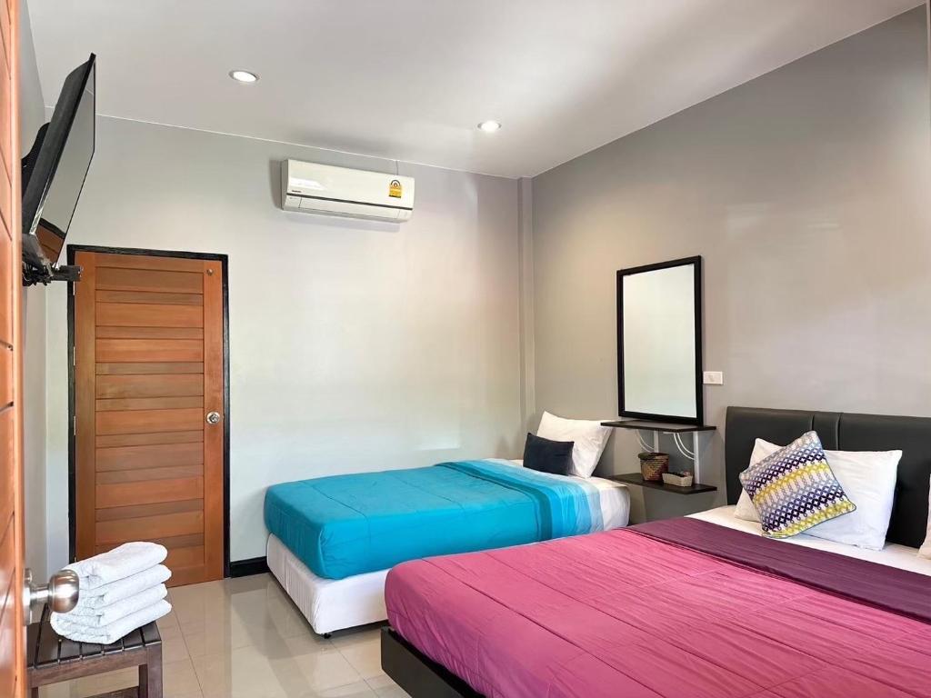 Ένα ή περισσότερα κρεβάτια σε δωμάτιο στο Saiinam Laguna Inn