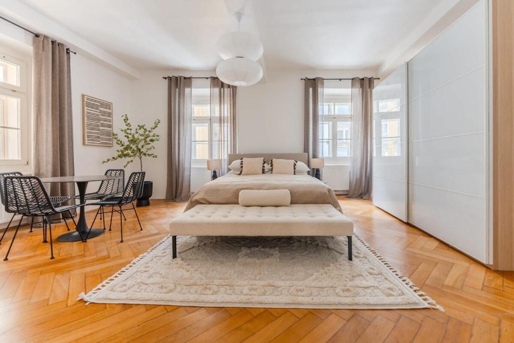 Postel nebo postele na pokoji v ubytování Hakuna - Penthouse Franziskanerplatz - Rooftop