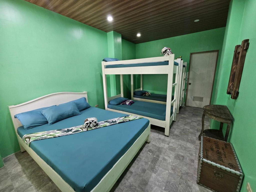 Postel nebo postele na pokoji v ubytování Airusxander Beach Resort