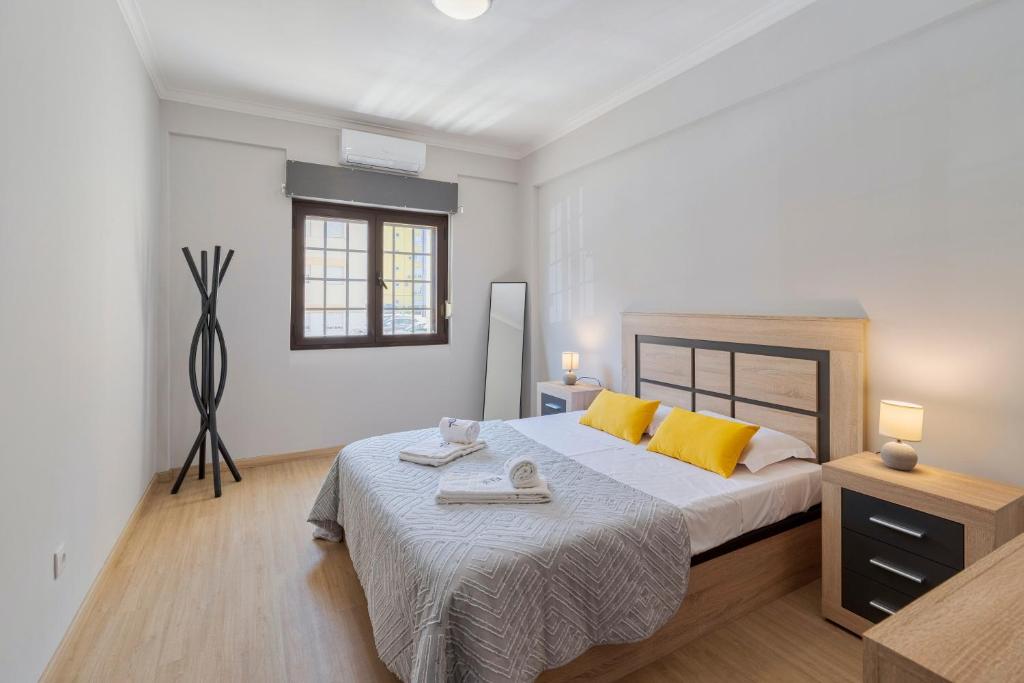 En eller flere senge i et værelse på Lisboa no Sado - By Y Concept