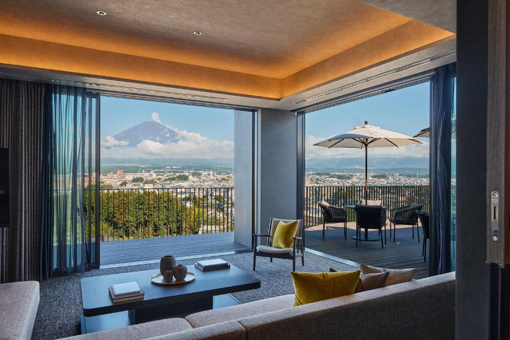 a living room with a couch and a view of a mountain at edit x seven FUJI GOTEMBA in Gotemba