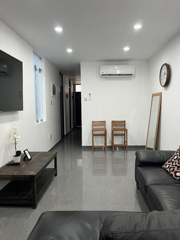 a living room with a couch and a table at MH Apartments Ica 3 in Ica