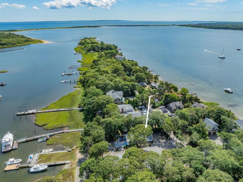 an aerial view of a small island in the water at 28 Seconsett Point Road Mashpee - Betty's By The Bay in Mashpee