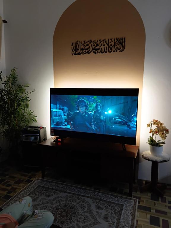 a flat screen tv sitting in a living room at Politeknik metro kl in Kuala Lumpur