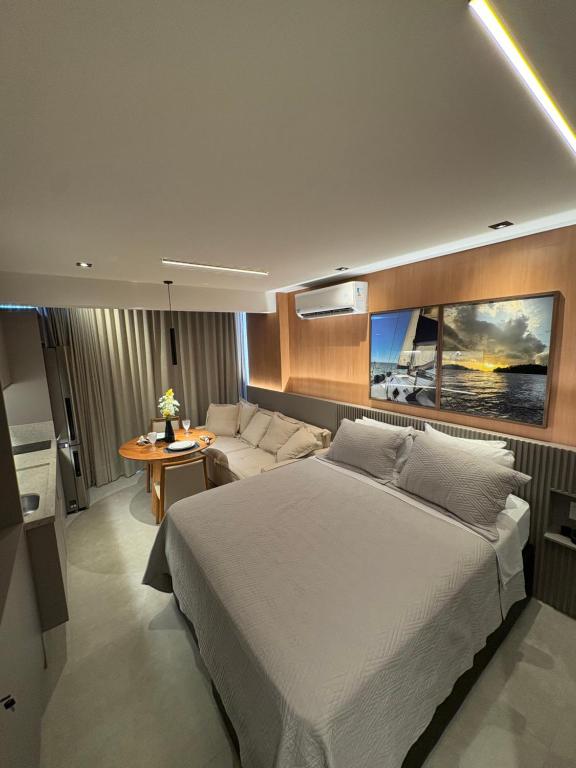 Postel nebo postele na pokoji v ubytování Studio novíssimo - Alive melhor localização