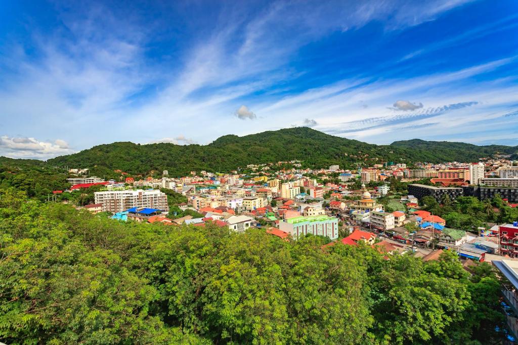 a view of a city from a hill at Apartments at The Bliss Condo by Lofty in Patong Beach