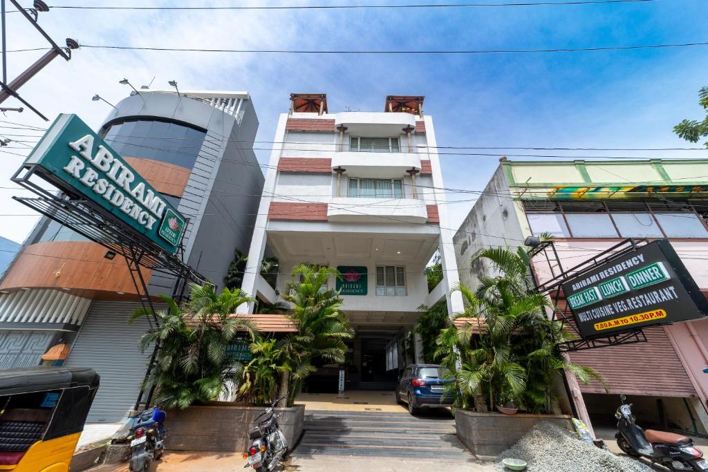 a building with motorcycles parked in front of it at Abirami Residency in Pondicherry