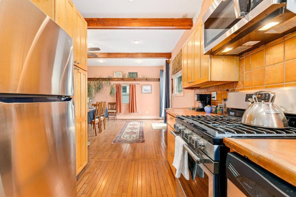 a kitchen with a stove and a counter top at Unique Eastport Bungalow w Yard in Annapolis