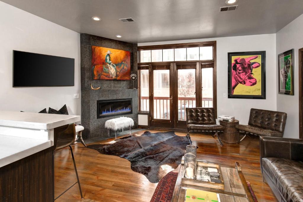 a living room with a couch and a fireplace at LIFT LODGE 102 condo in Park City