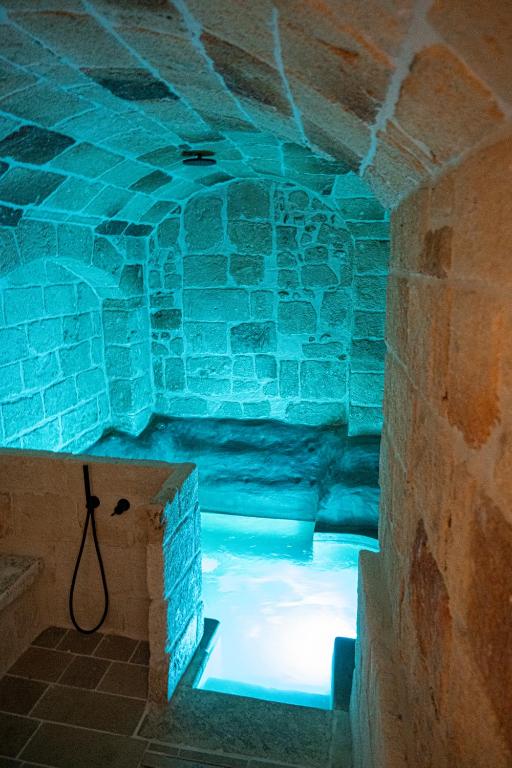a room with a blue light in a ice cave at Dimora Negli Archi in Monopoli