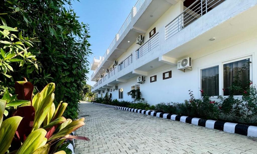 a cobblestone street in front of a building at Dreamland Resort in Nainital
