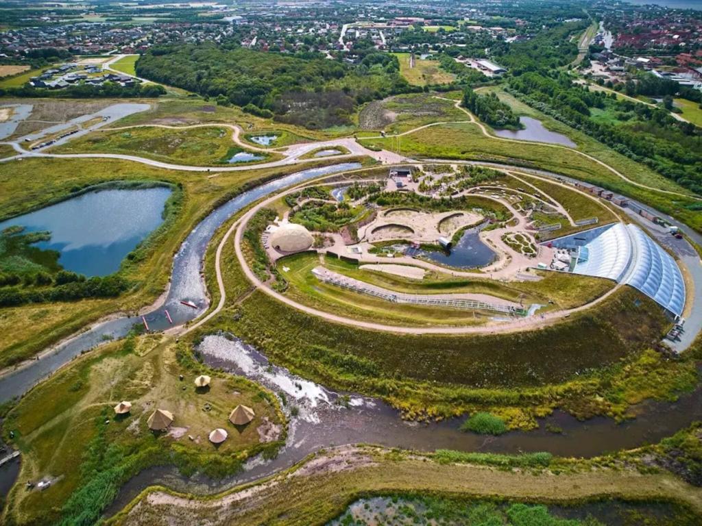 an aerial view of a park with a river at Holiday home in Denmark in Ringkøbing