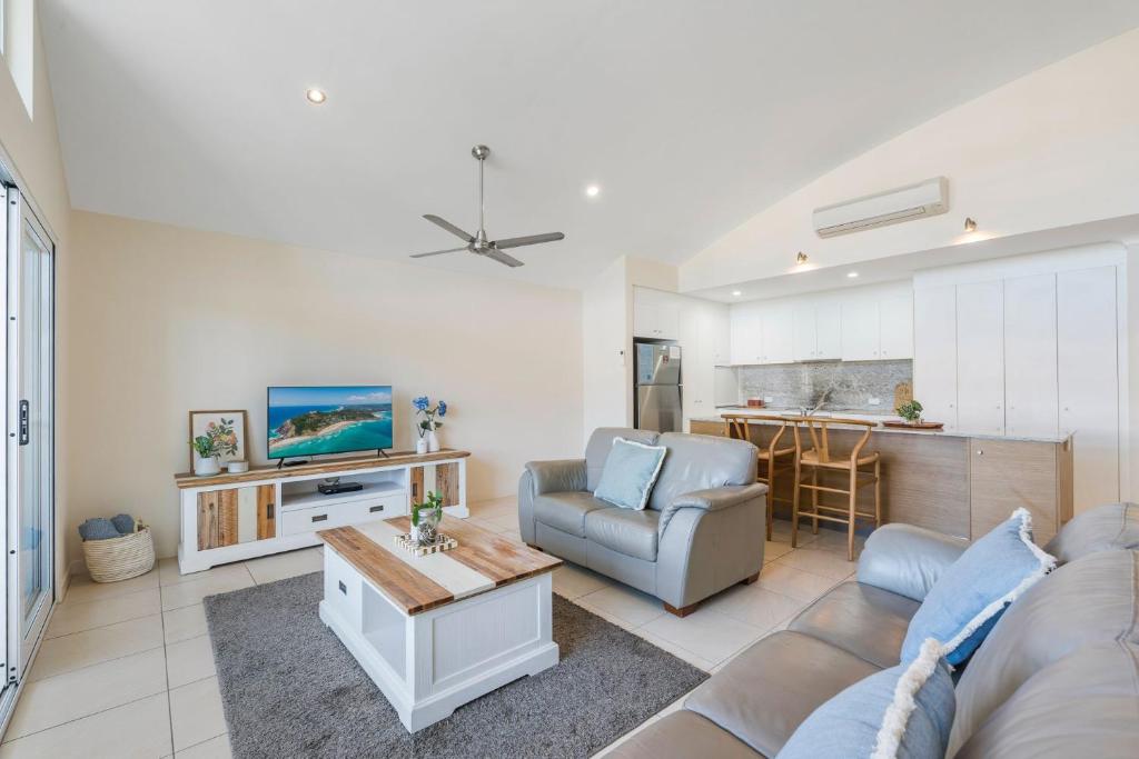 a living room with a couch and a table at Malibu Apartments Unit 1 - 5 Oak Street in Evans Head