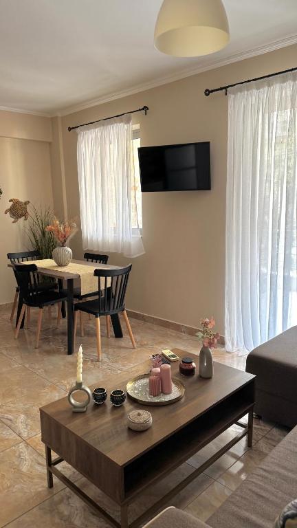 a living room with a couch and a table at Anesis home in Gythio