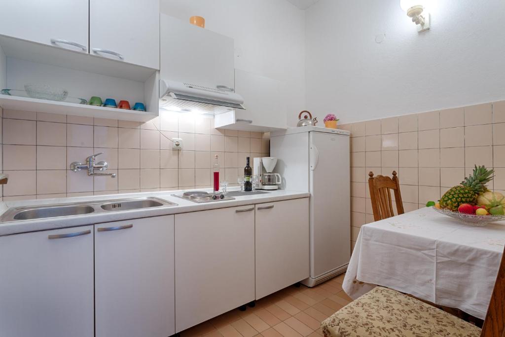 Kuchyň nebo kuchyňský kout v ubytování Guest house "Litus"