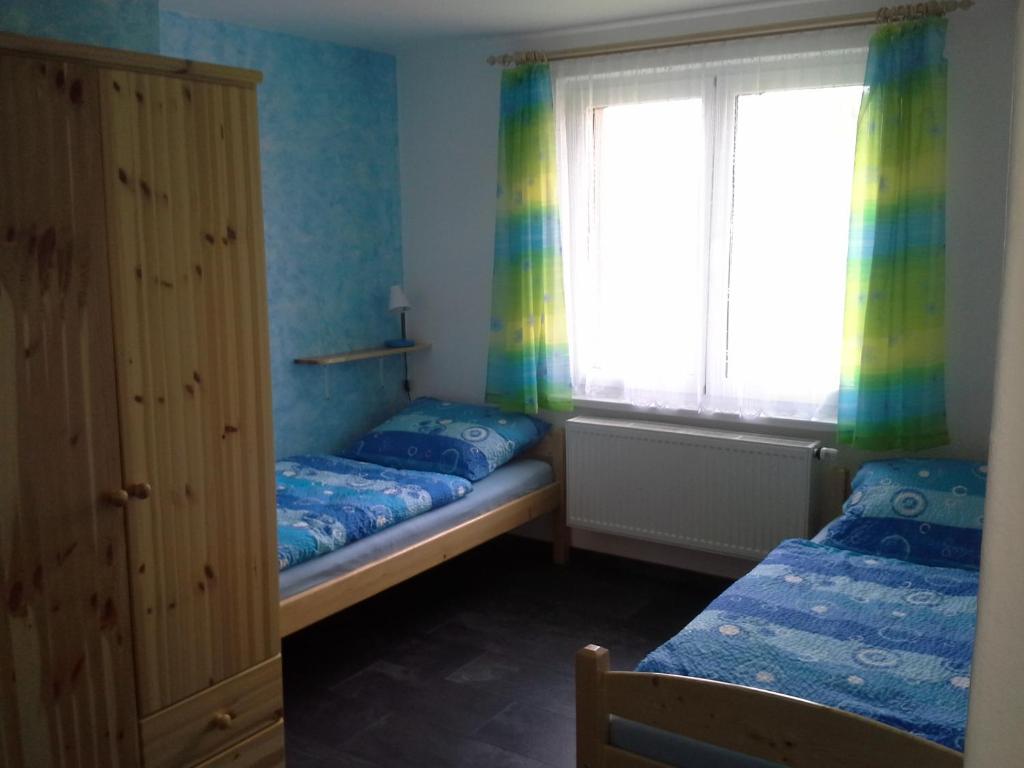 Postel nebo postele na pokoji v ubytování Apartmán Hastrmánek, Kvilda 3