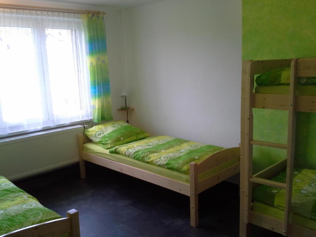 Postel nebo postele na pokoji v ubytování Apartmán Hastrmánek, Kvilda 3