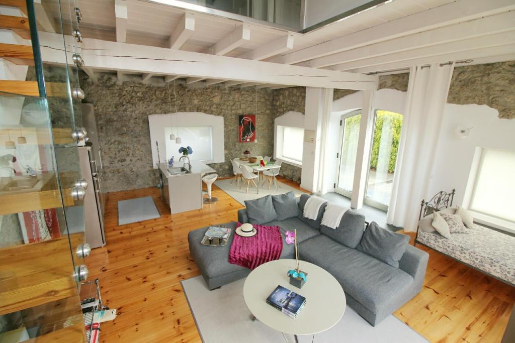 a living room with a couch and a table at Villas San Roque Isla in Isla